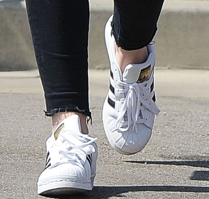 Dakota Fanning wearing didas Originals 'Superstar 80s DLX' sneakers